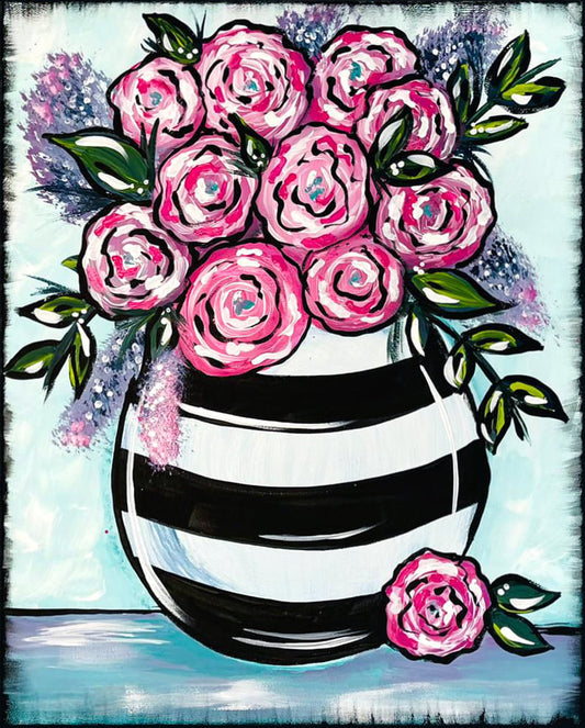 BLACL AND WHITE STRIPED VASE WITH PINK FLOWERS